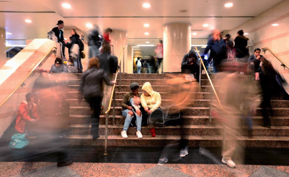 With limited seating for riders waiting for trains at Penn Station, N.J. Transit riders sit on stairways at Penn Station on a Sunday afternoon Oct. 27, 2019. 