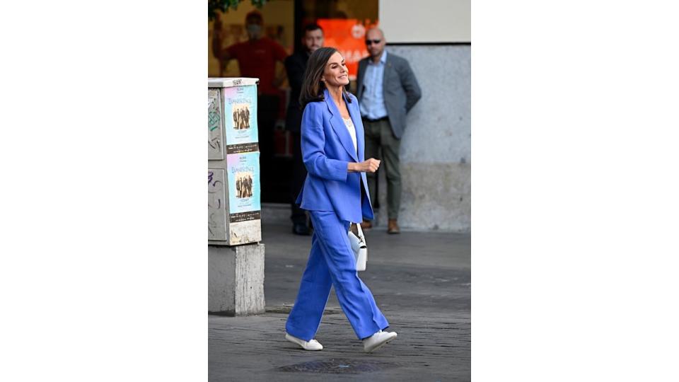 Queen Letizia walking in a new indigo blue suit