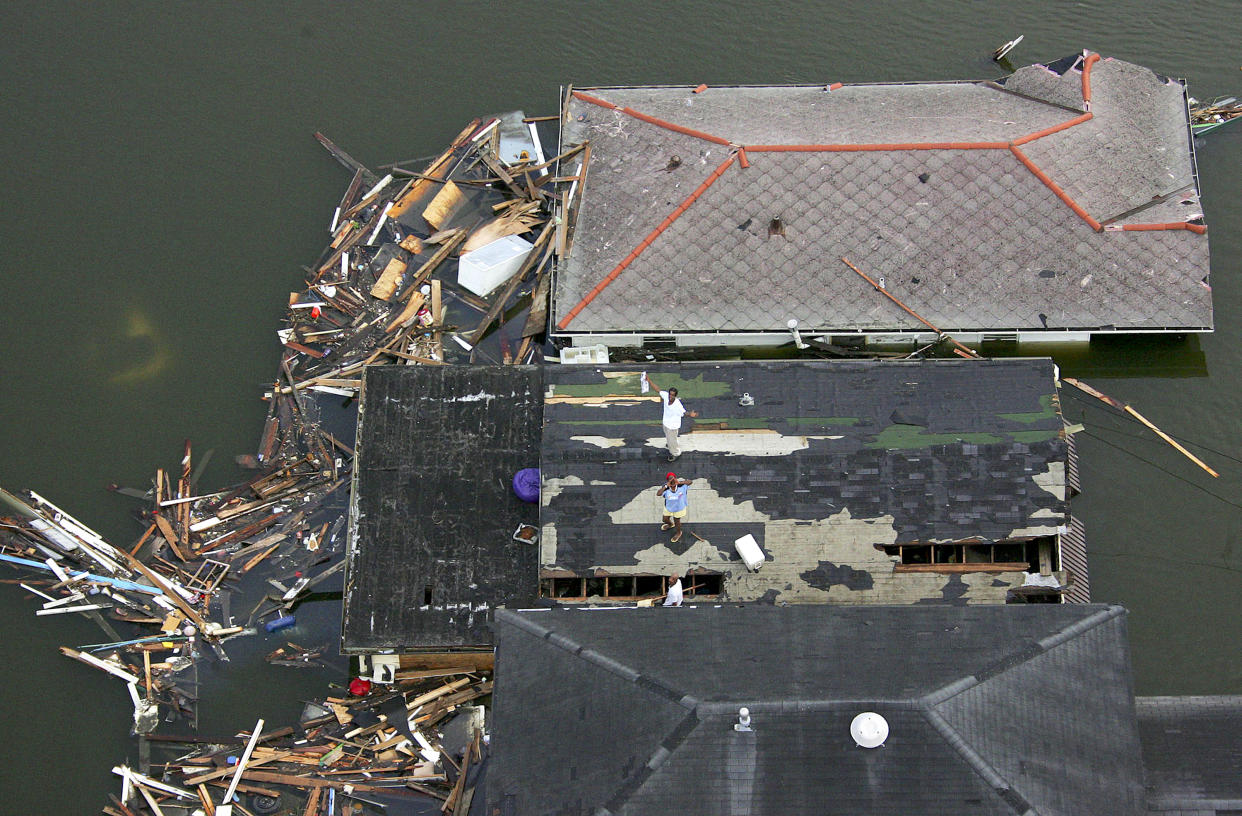 People stranded on a roof in the aftermath of Hurricane Katrina 