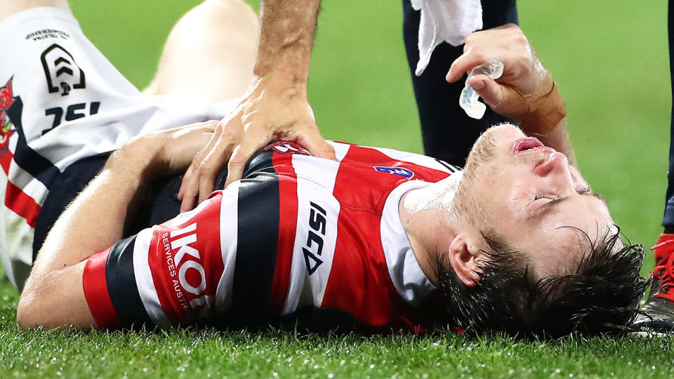 Luke Keary, pictured here going down injured in the Roosters' clash with the Storm.