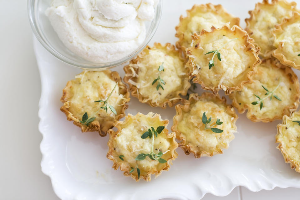 In this undated photo, ricotta cheese creates a rich and creamy base for crab bites perfect for a holiday party as shown served on a tray in Concord, N.H. (AP Photo/Matthew Mead)