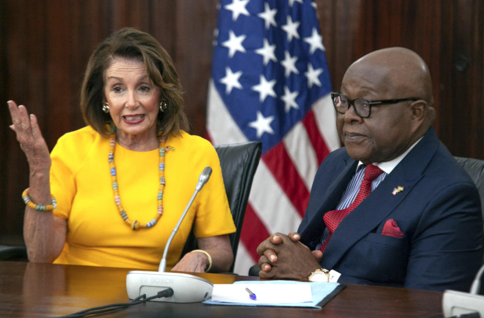 US House Speaker Nancy Pelosi speaks with Speaker of the Parliament Aaron Mike Oquaye at Ghana's Parliament in Accra, Ghana, Wednesday, July 31, 2019. Pelosi and other members of the U.S. Congress plan discussions on "regional security, sustainable and inclusive development and the challenges of tomorrow including the climate crisis." (AP Photo/Christian Thompson)