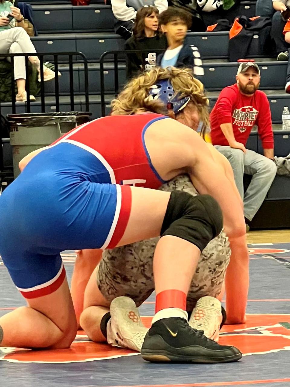 Highland's Remington Baker gets the advantage on Clear Fork's Cody Jackson in the 150-pound championship match at the Mid Ohio Athletic Conference Wrestling Tournament Saturday at Galion.