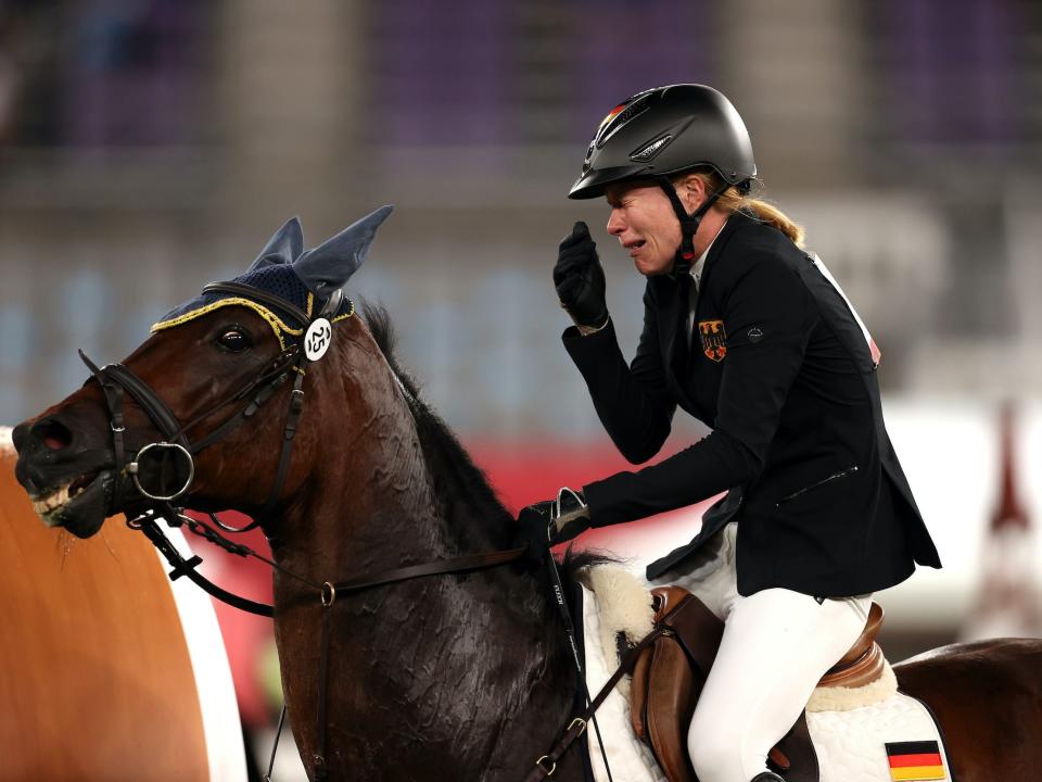 Annika Schleu of Team Germany looks dejected following her run in the Riding Show Jumping of the Women's Modern Pentathlon.