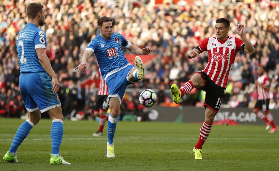 <p>Southampton’s Dusan Tadic in action with Bournemouth’s Dan Gosling </p>