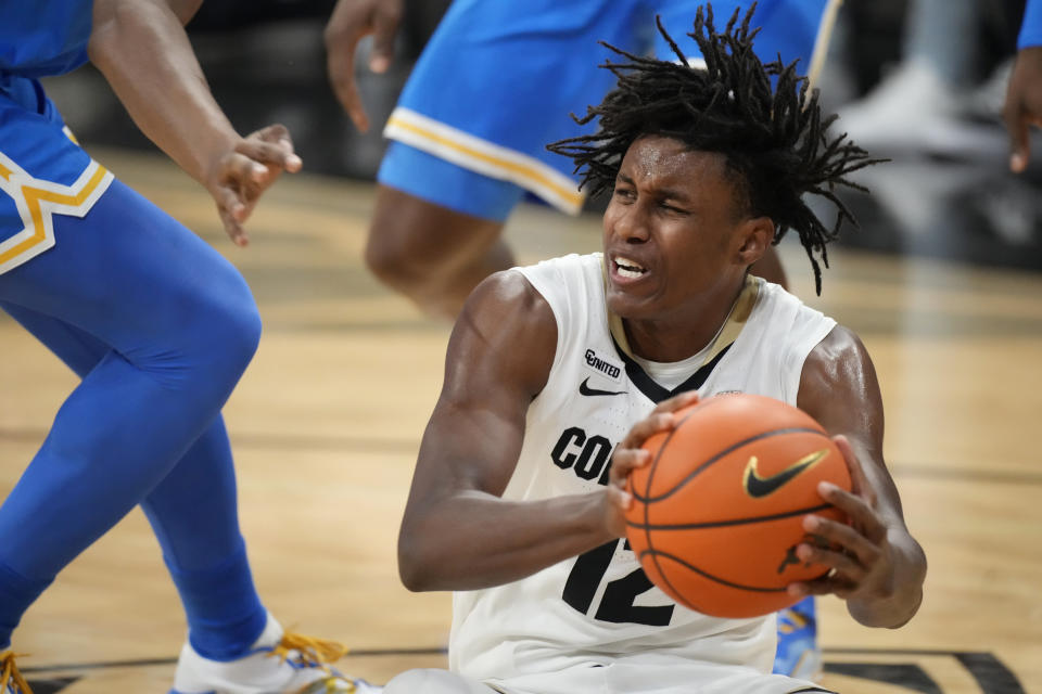 Colorado forward Jabari Walker pulls in a loose ball during the first half of the team's NCAA college basketball game against UCLA on Saturday, Jan. 22, 2022, in Boulder, Colo. (AP Photo/David Zalubowski)
