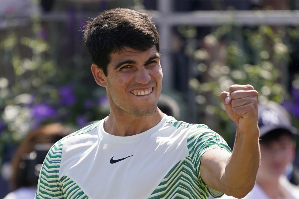 FILE - Carlos Alcaraz, of Spain, celebrates after defeating Alex de Minaur, of Australia, 6/4, 6/4 in their mens singles final match at the Queens Club tennis tournament in London, Sunday, June 25, 2023. Alcaraz is expected to compete at Wimbledon next week. (AP Photo/Alberto Pezzali, File)