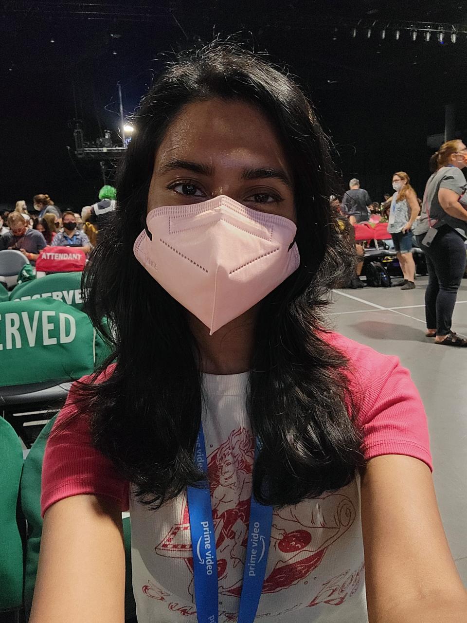 An Insider reporter wearing a mask inside Hall H at San Diego Comic-Con 2022.