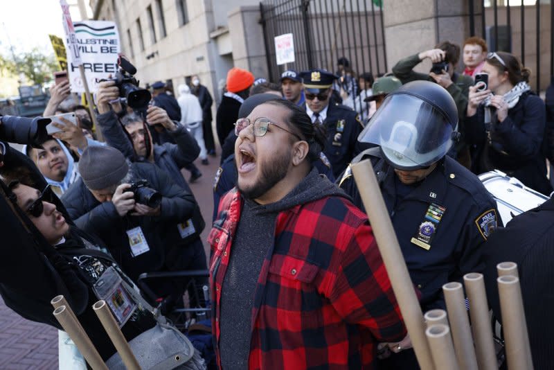 A pro-Palestinian protester is arrested at Columbia University in New York on Monday. Columbia University announced that classes would be held remotely starting Monday, as pro-Palestinian protests continued for the sixth day on the school's campus. Photo by John Angelillo/UPI