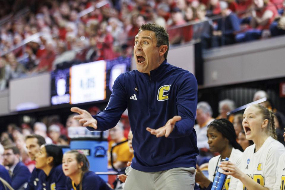 Chattanooga head coach Shawn Poppie shouts to his team during the first half of a first-round college basketball game against North Carolina State in the NCAA Tournament in Raleigh, N.C., Saturday, March 23, 2024. (AP Photo/Ben McKeown)