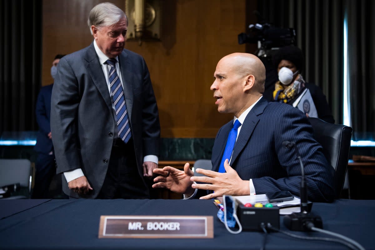 Republican Lindsey Graham and Democrat Cory Booker are from different sides of the political divide  (Getty Images)