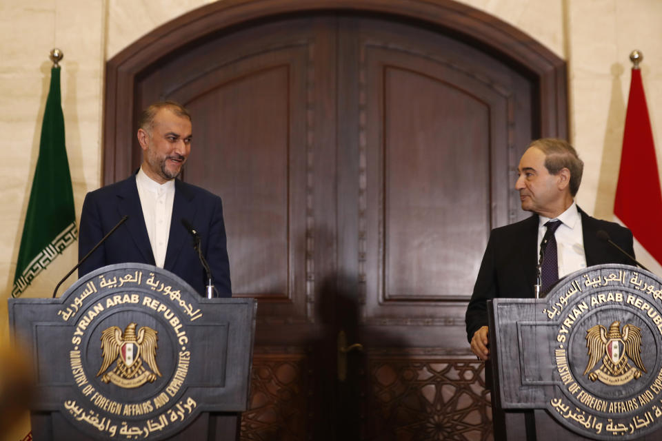 Syrian Foreign Minister Faisal Mekdad, right, speaks with Iranian Foreign Minister Hossein Amirabdollahian during a joint press conference in Damascus, Syria, Monday, April 8, 2024. Iran's foreign minister Monday accused the United States of giving Israel the "green light" to strike its consulate building in Syria that killed seven Iranian military officials including two generals. (AP Photo/Omar Sanadiki)