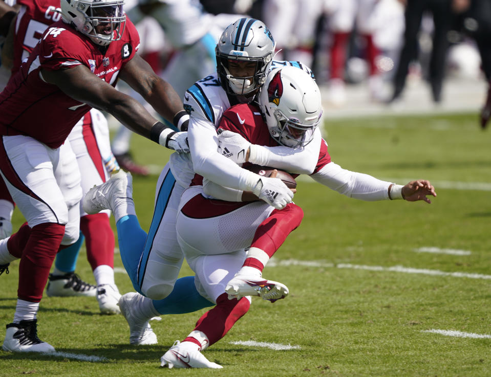 Arizona Cardinals quarterback Kyler Murray is tackled by Carolina Panthers defensive end Yetur Gross-Matos during the first half of an NFL football game Sunday, Oct. 4, 2020, in Charlotte, N.C. (AP Photo/Brian Blanco)