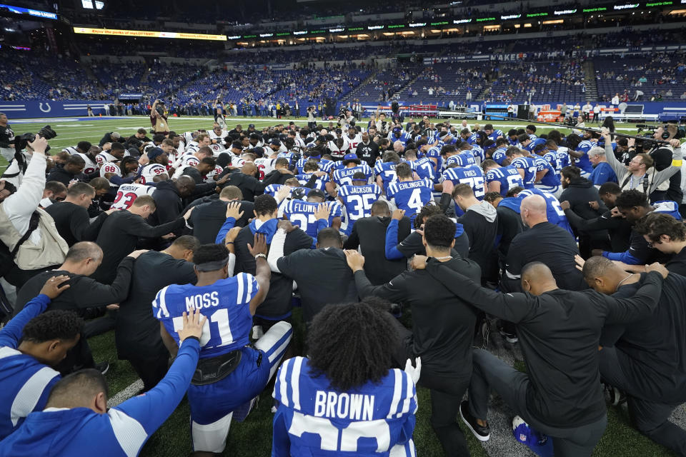 The Houston Texans and Indianapolis Colts gather on the field before their NFL football game in support of Buffalo Bills safety Damar Hamlin, Sunday, Jan. 8, 2023, in Indianapolis. (AP Photo/Darron Cummings)
