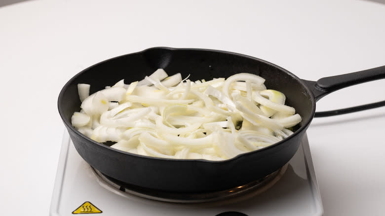 sliced onions in a pan
