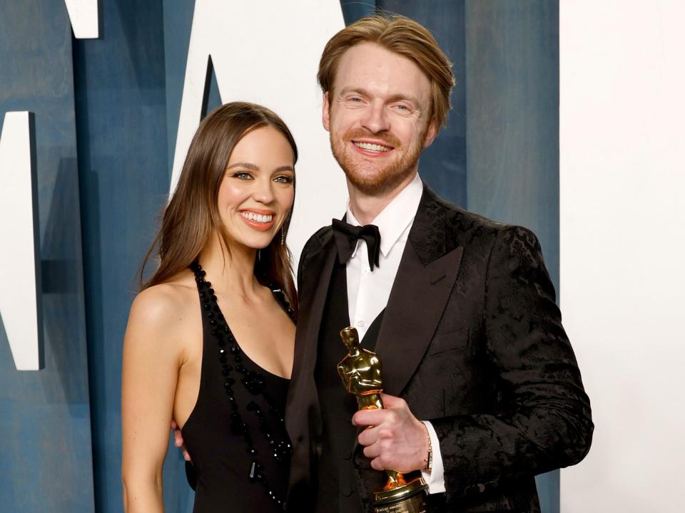 Claudia Sulewski and Finneas attend the 2022 Vanity Fair Oscar Party hosted by Radhika Jones at Wallis Annenberg Center for the Performing Arts on March 27, 2022 in Beverly Hills, California