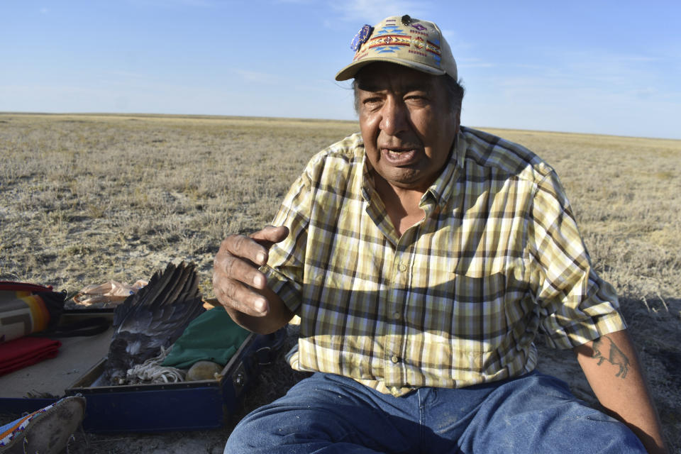 Tribal elder Buster Moore speaks about the importance of swift foxes and other wildlife who are considered "relatives" of Aaniiih and Nakoda people of Fort Belknap Indian Reservation Wednesday, Sept. 28, 2022, near Fort Belknap Agency, Mont. Native species such as swift foxes and black-footed ferrets disappeared from the Fort Belknap Indian Reservation generations ago, wiped out by poisoning campaigns, disease and farm plows that turned open prairie where nomadic tribes once roamed into cropland and cattle pastures. (AP Photo/Matthew Brown)