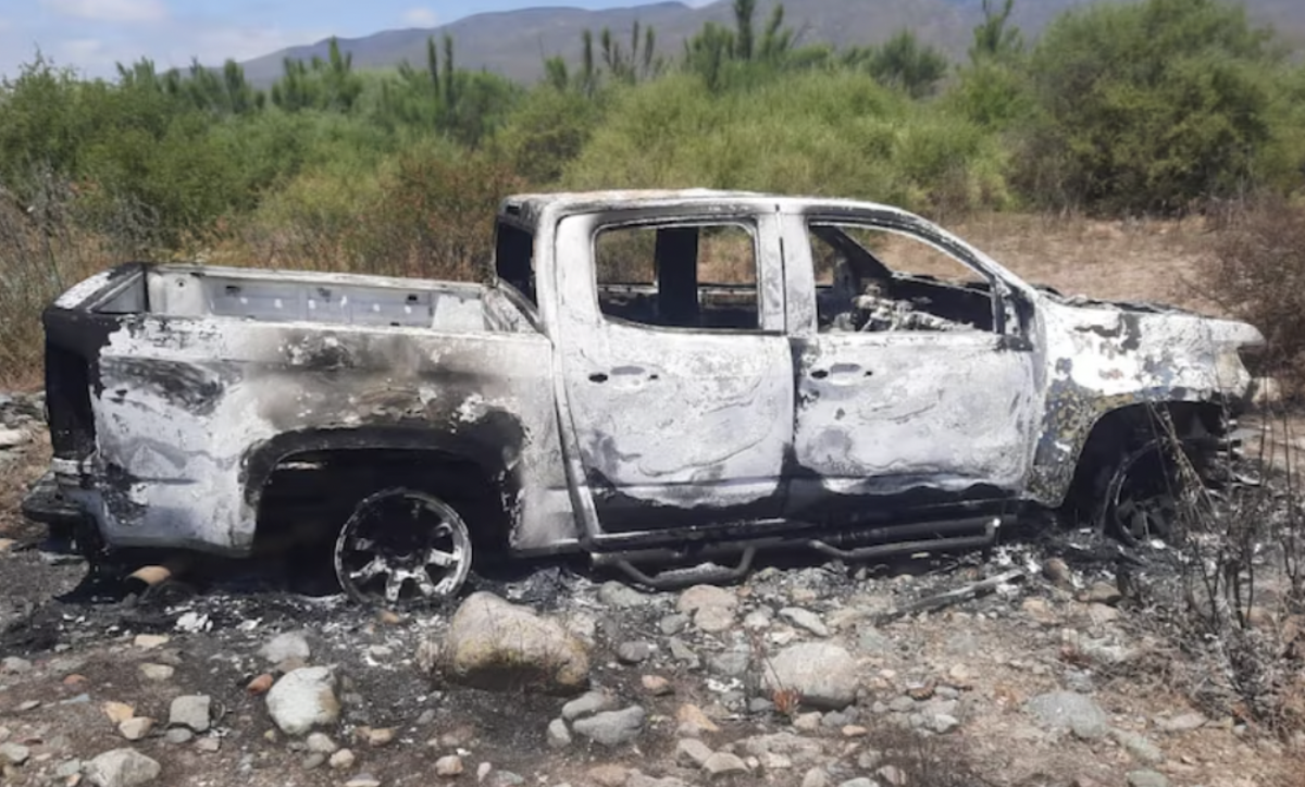 The truck of the missing surfers, found burnt on a nearby ranch.<p>Photo: Baja California Attorney General’s Office</p>