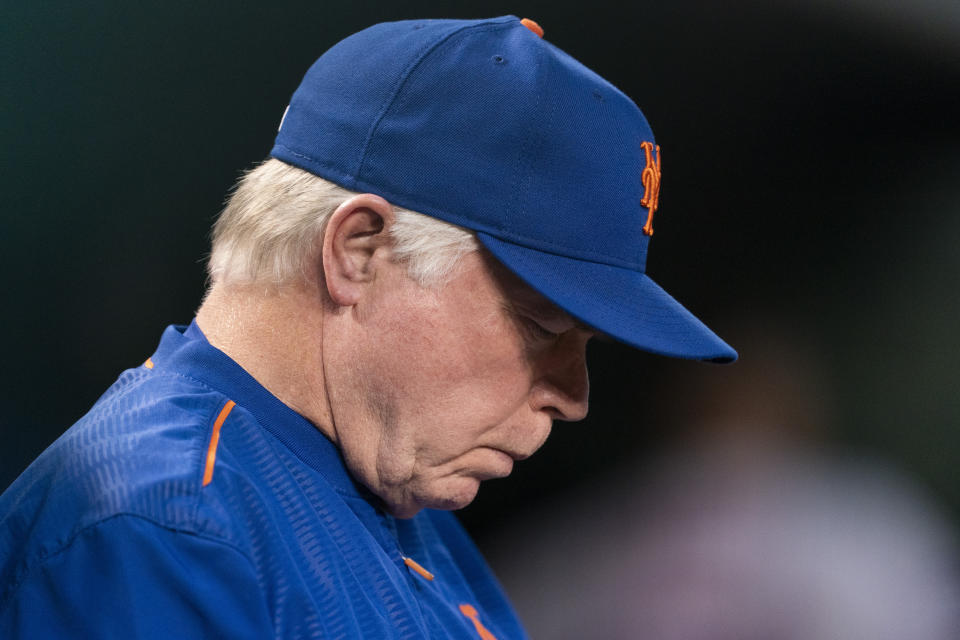 New York Mets manager Buck Showalter looks down while in the dugout during the second inning of a baseball game against the Washington Nationals, Tuesday, Sept. 5, 2023, in Washington. (AP Photo/Stephanie Scarbrough)