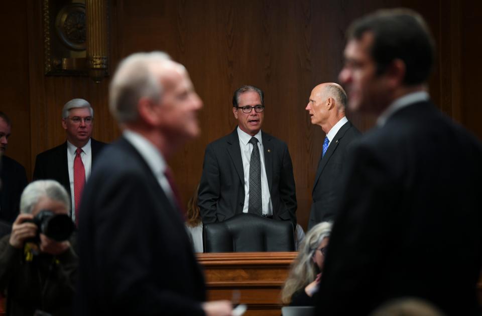 Senator Mike Braun, R-Indiana, speaking with Senator Rick Scott, R-Florida, as arrive for a United States Senate Special Committee on Aging hearing held in the Dirksen Senate office building examining issue of elder fraud.