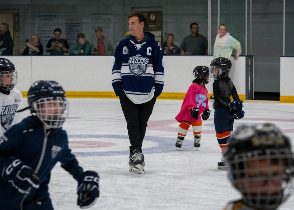 Youth hockey players fill the rink during an open skate to celebrate the retirement of Worcester Railers captain Bobby Butler on Tuesday at the Worcester Ice Center.