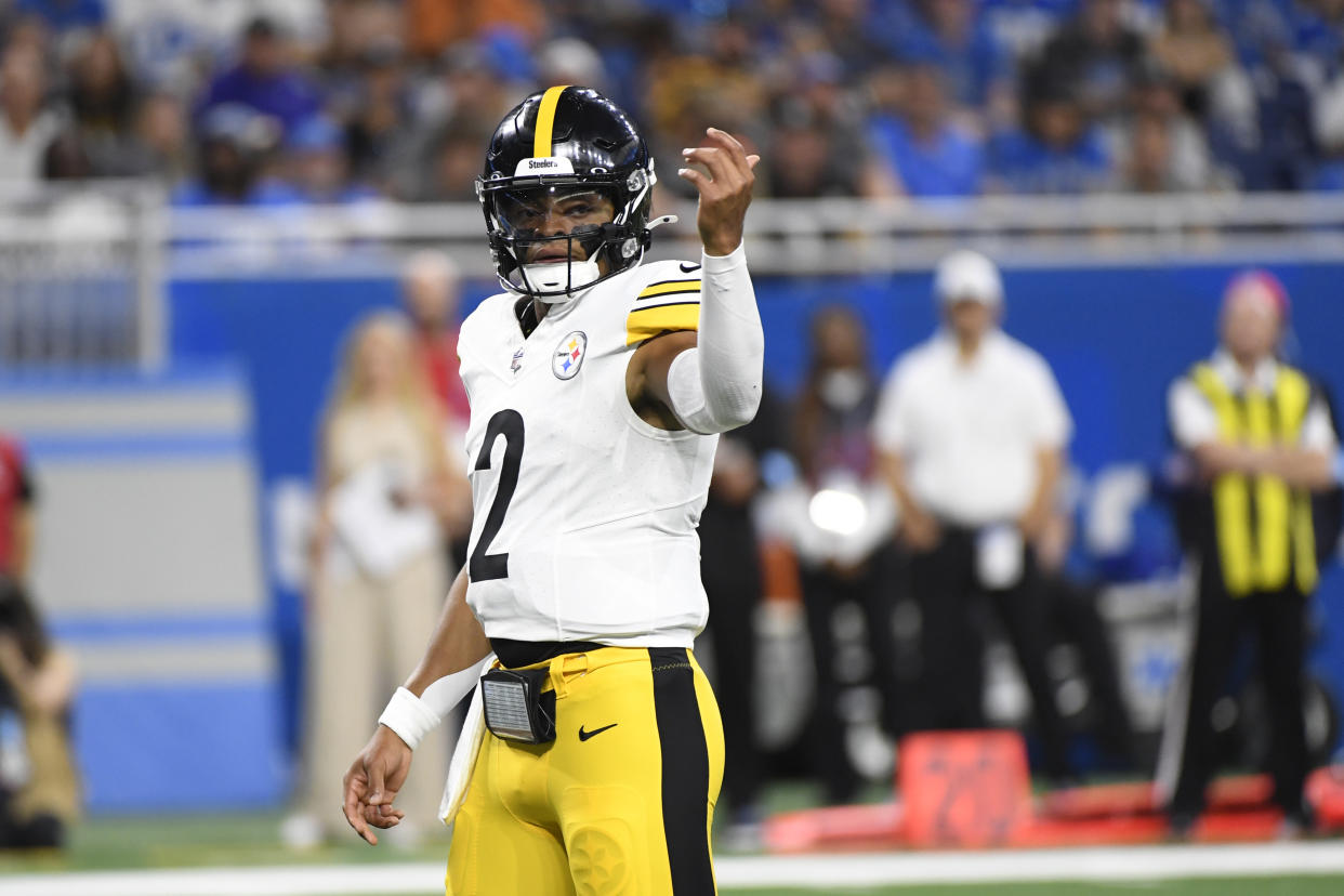 Pittsburgh Steelers quarterback Justin Fields signals during the first half of an NFL preseason football game against the Detroit Lions, Saturday, Aug. 24, 2024, in Detroit. (AP Photo/Jose Juarez)