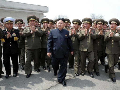 This file photo, released by North Korea's official Korean Central News Agency (KCNA) on April 28, shows N.Korean leader Kim Jong-Un (C) surrounded by officers of Korean People's Army (KPA) during the general tactical exercise of an army unit