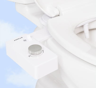 Close-up of a Tushy bidet knob