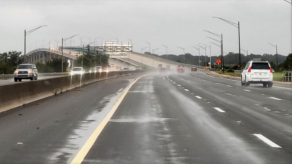 The Atlantic Boulevard bridge over the Intracoastal Waterway in Atlantic Beach was wet and windy, but still open at noon Wednesday as Hurricane Ian's winds and rain were on their way.