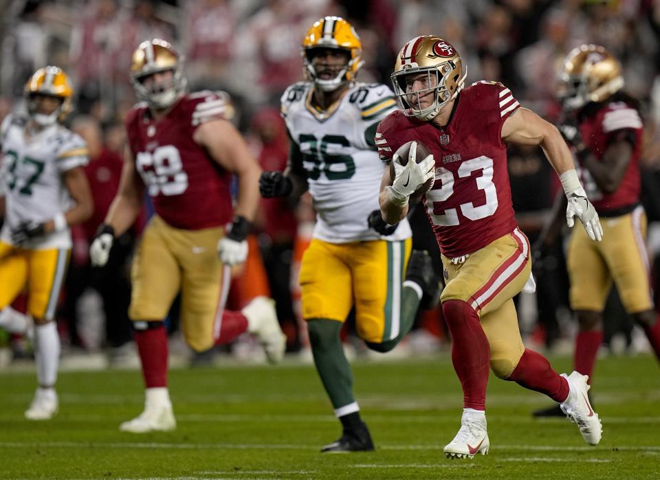 San Francisco 49ers running back Christian McCaffrey (23) scores a touchdown on a 39-yard run during the third quarter of their NFC divisional playoff game Saturday, January 20, 2024 at Levi's™ Stadium in Santa Clara, California. The San Francisco 49ers beat the Green Bay Packers 24-21.