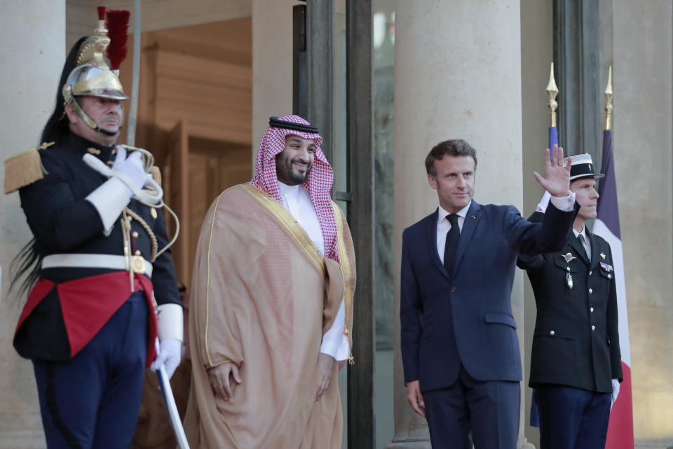 French President Emmanuel Macron welcomes Saudi Crown Prince Mohammed bin Salman for a dinner at the Elysee Palace in Paris, Thursday July 28, 2022. French President Emmanuel Macron welcomed Saudi Crown Prince Mohammed bin Salman to his presidential palace and offer him dinner, marking another step in the Saudi leader's diplomatic rehabilitation less than four years after the killing of writer and critic Jamal Khashoggi. (AP Photo/Lewis Joly)