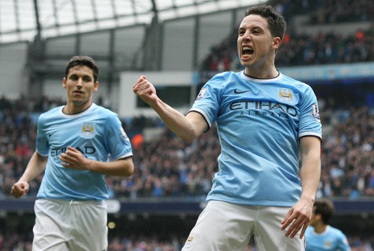 Samir Nasri (right) celebrates scoring Manchester City's second goal against Southampton at the Etihad Stadium in Manchester, northwest England, on April 5, 2014