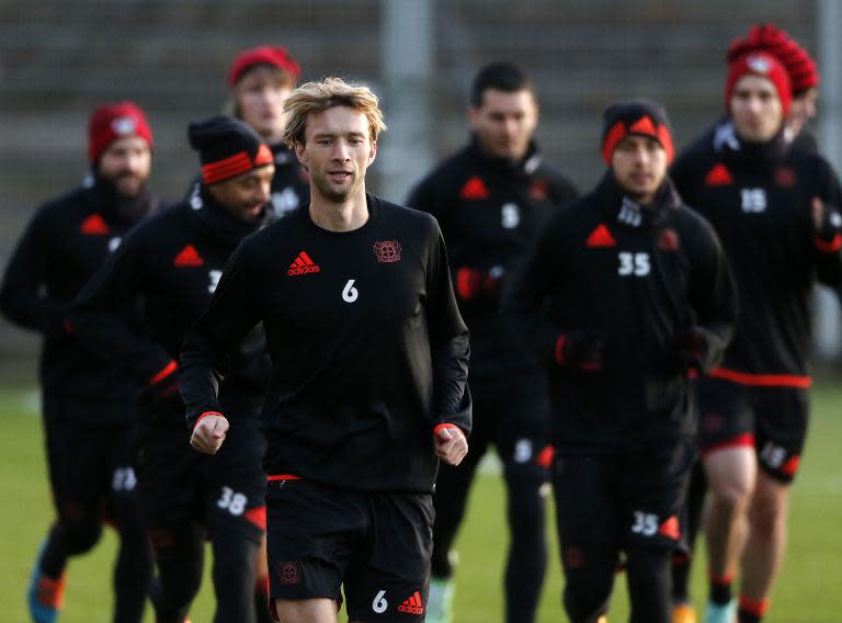 Bayer Leverkusen's forward Simon Rolfes and his teammates take part in a training session in Leverkusen, western Germany, on November 25, 2014, on the eve of their UEFA Champions League Group C against Monaco