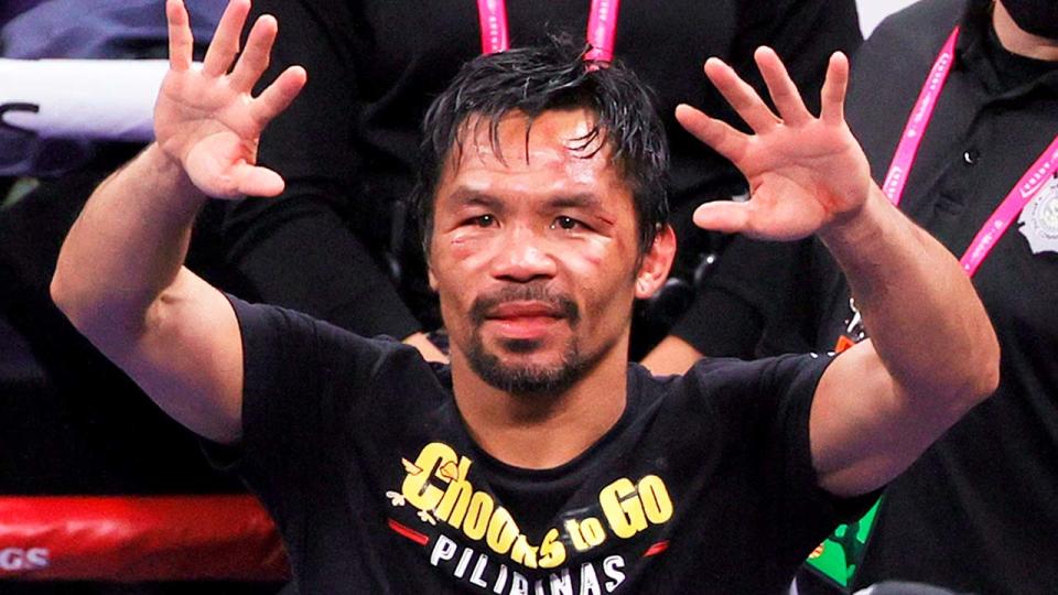 Legendary boxer Manny Pacquiao (pictured) waves at the crowd.