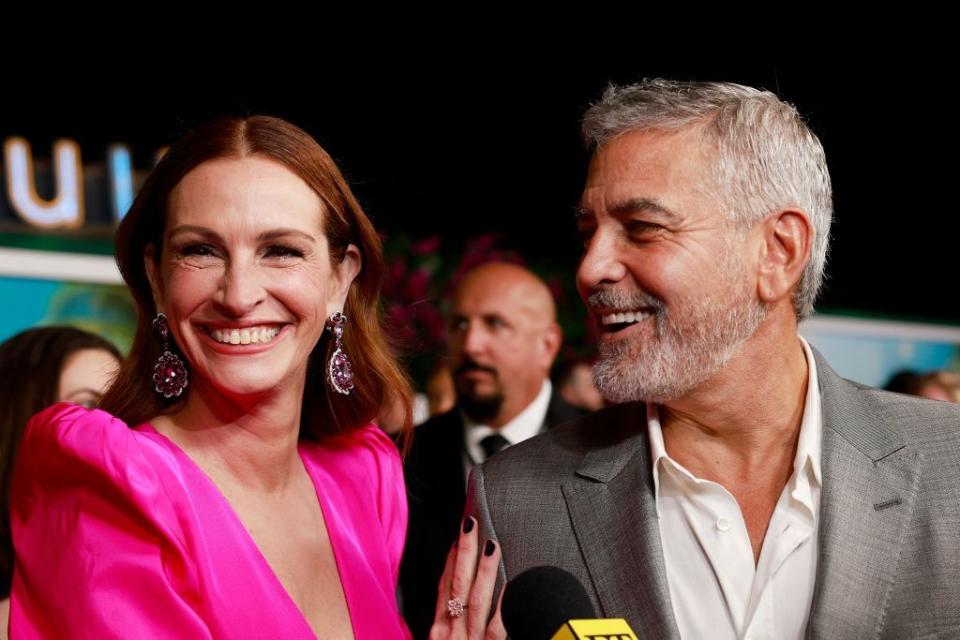 us actress julia roberts l and us actor george clooney arrive for the premiere of ticket to paradise at the regency village theatre in westwood, california, on october 17, 2022 photo by michael tran  afp photo by michael tranafp via getty images