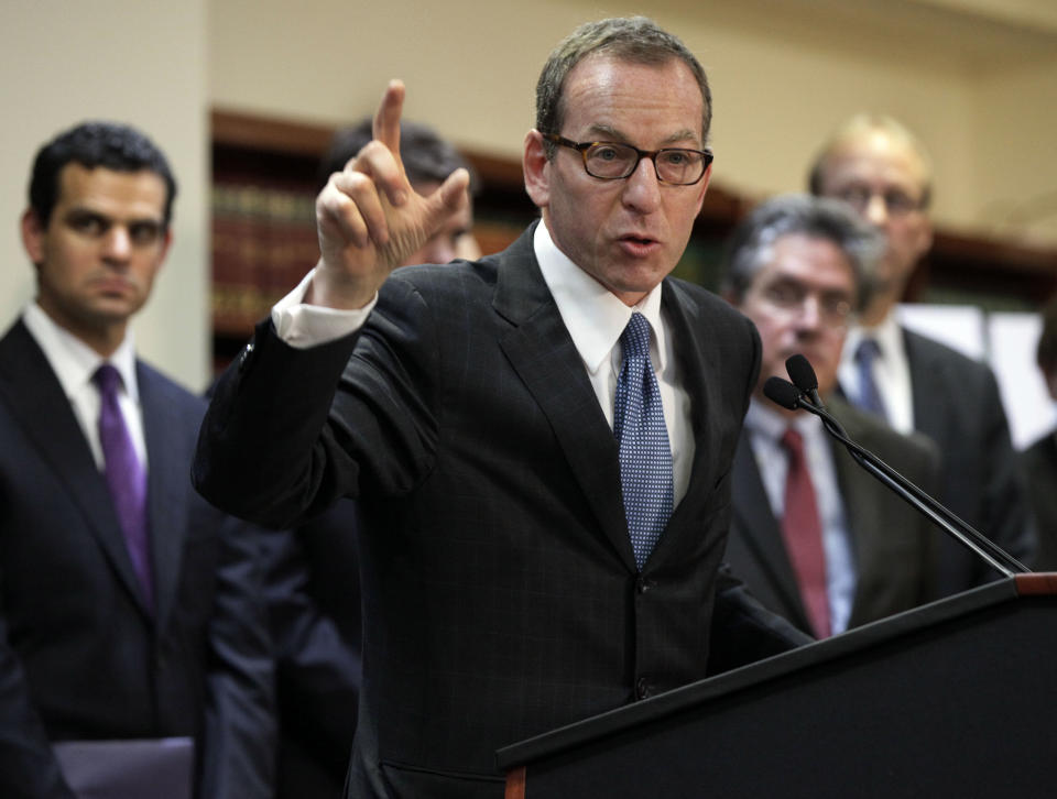 Lanny Breuer, center, Assistant Attorney General of the Justice Department's Criminal Division, addresses a news conference in Brooklyn, N.Y., Tuesday, Dec. 11, 2012. British bank HSBC has agreed to pay $1.9 billion to settle a New York based-probe in connection with the laundering of money from narcotics traffickers in Mexico, U.S. authorities announced Tuesday. Among those joining Breuer is Treasury Under Secretary David Cohen, left. (AP Photo/Richard Drew)