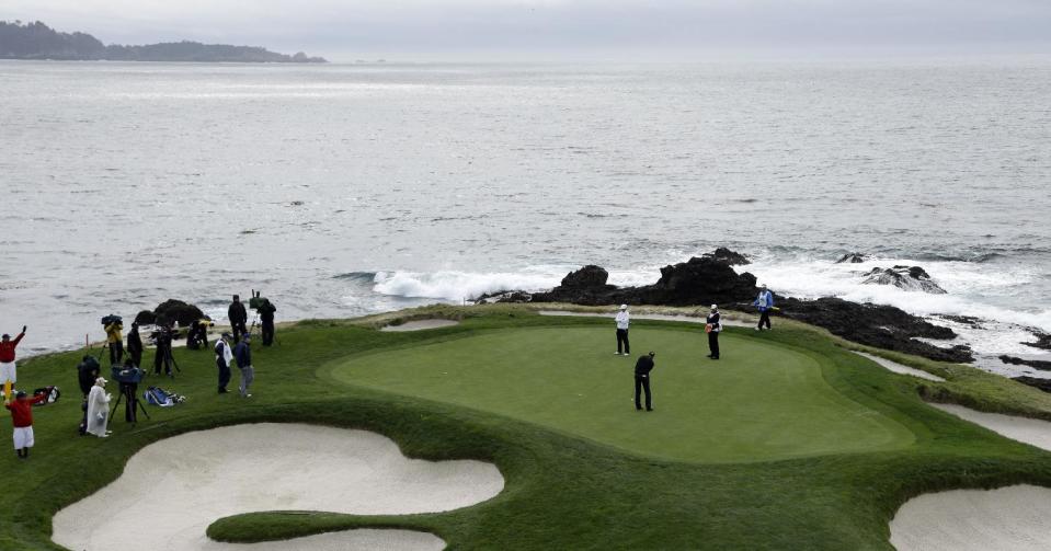 Jimmy Walker putts on the seventh green Sunday, Feb. 9, 2014, during the final round of the AT&T Pebble Beach Pro-Am golf tournament in Pebble Beach, Calif. (AP Photo/Ben Margot)