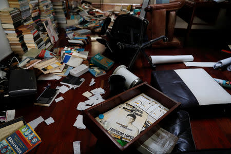 Books and personal belongings are seen on the floor of the residence of opposition leader Leopoldo Lopez and his family, after unidentified government officials illegally entered the house, according to the family's lawyer Omar Mora Tosta, in Caracas, Venezuela May 2, 2019. REUTERS/Carlos Garcia Rawlins