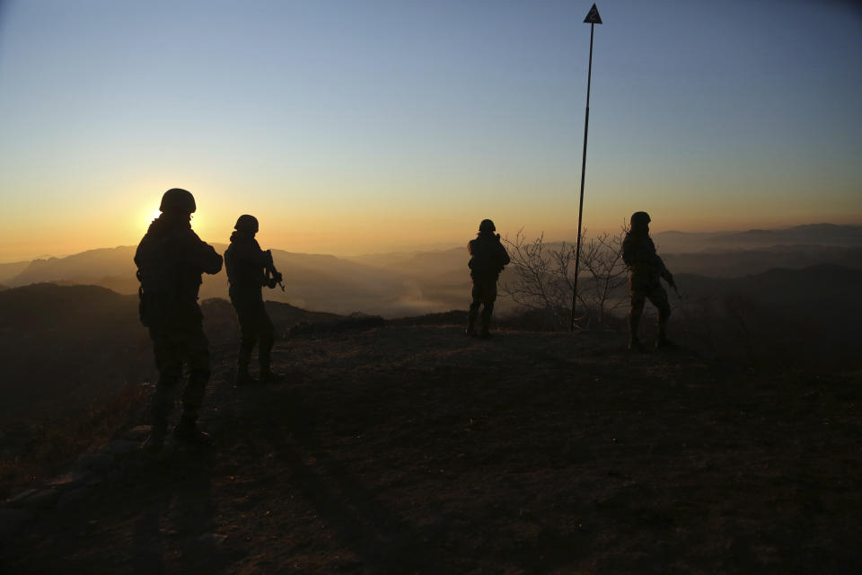 Indian army soldiers patrol at the Line of Control (LOC) between India and Pakistan border in Poonch, about 250 kilometers (156 miles) from Jammu, India, Thursday, Dec. 18, 2020. From sandbagged Indian army bunkers dug deep into the Pir Panjal mountains in the Himalayas, villages on the Pakistan-controlled side of Kashmir appear precariously close, on the other side of the Line of Control that for the past 73 years has divided the region between the two nuclear-armed rivals. Tens of thousands of soldiers from India and Pakistan are positioned along the two sides. The apparent calm is often broken by the boom of blazing guns, with each side accusing the other of initiating the firing. (AP Photo/Channi Anand)