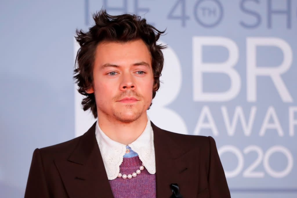 Harry Styles has posed in a pair of fishnet tights and loafers, pictured here at the Brits earlier this year. (Getty Images)