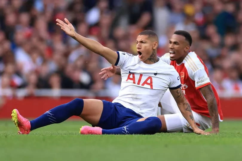 Richarlison and Gabriel Magalhaes react during the Premier League match between Arsenal FC and Tottenham Hotspur at Emirates Stadium on September 24, 2023.