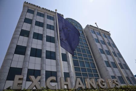 A European Union flag flutters outside the Athens stock exchange, Greece, July 27, 2015. REUTERS/Ronen Zvulun