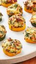 <p>These little guys are scary addictive. Just as the courgette becomes tender, the cheese is getting melty and delicious.</p><p>Get the <a href="https://www.delish.com/uk/cooking/recipes/a33664100/spinach-artichoke-zucchini-bites-recipe/" rel="nofollow noopener" target="_blank" data-ylk="slk:Spinach Artichoke Courgette Bites;elm:context_link;itc:0;sec:content-canvas" class="link ">Spinach Artichoke Courgette Bites</a> recipe.</p>