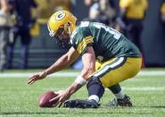 Sep 16, 2018; Green Bay, WI, USA; Green Bay Packers quarterback Aaron Rodgers (12) recovers his own fumble in the fourth quarter during the game against the Minnesota Vikings at Lambeau Field. Mandatory Credit: Benny Sieu-USA TODAY Sports