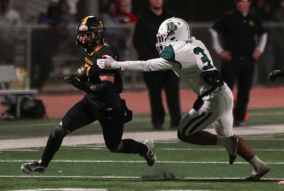 Javin Hudson runs for a first down for Yucca Valley during their CIF win over Buena Park in Yucca Valley , Calif., Nov. 10, 2023.