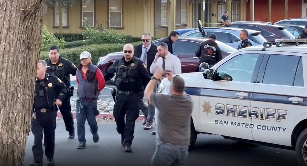 Chunli Zhao being arrested Monday in the parking lot of the San Mateo County Sheriff’s Office as a suspect in the mass shooting in Half Moon Bay earlier in the day. (Kati McHugh)