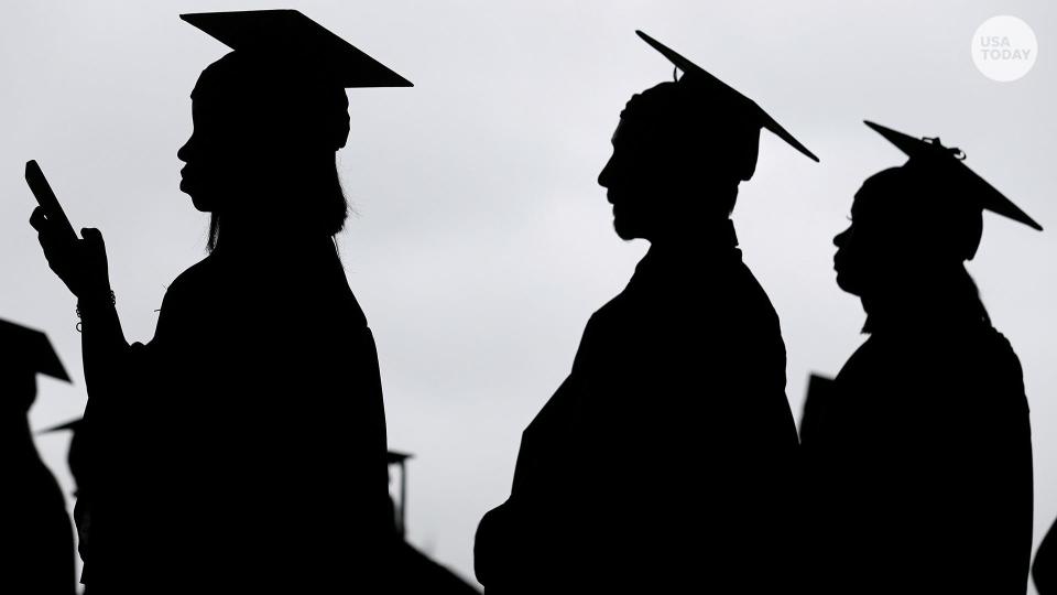 New graduates line up before the start of a community college commencement in East Rutherford, N.J., on May 17, 2018.