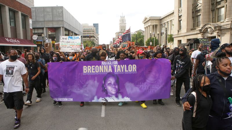 FILE PHOTO: Protesters march through downtown Louisville