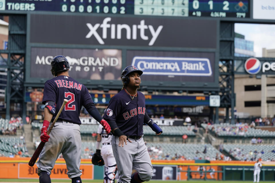 Cleveland Guardians designated hitter Jose Ramirez scores from second on a Oscar Gonzalez single to right center during the 10th inning of a baseball game, Thursday, Aug. 11, 2022, in Detroit. (AP Photo/Carlos Osorio)