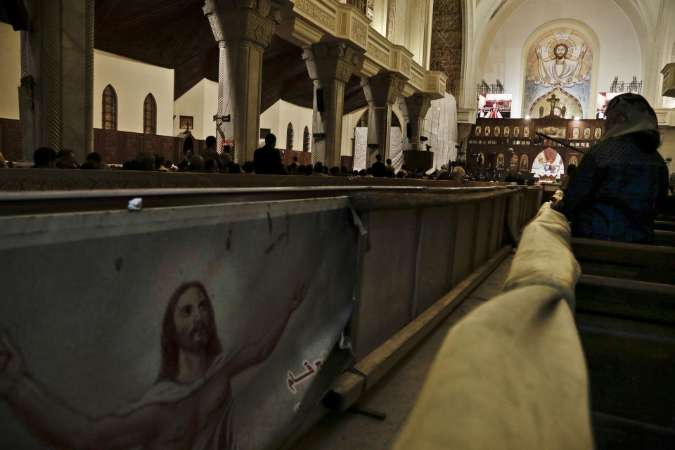 Egyptian Coptic Christians prepare to pray during the Easter Eve service at St. Mark's Cathedral in Cairo, Egypt, Saturday, April 15, 2017. In February, a series of murders and killings claimed by IS in northern Sinai led hundreds of families to evacuate the area, fleeing west. The most recent major attack came on Palm Sunday. (AP Photo/Nariman El-Mofty)